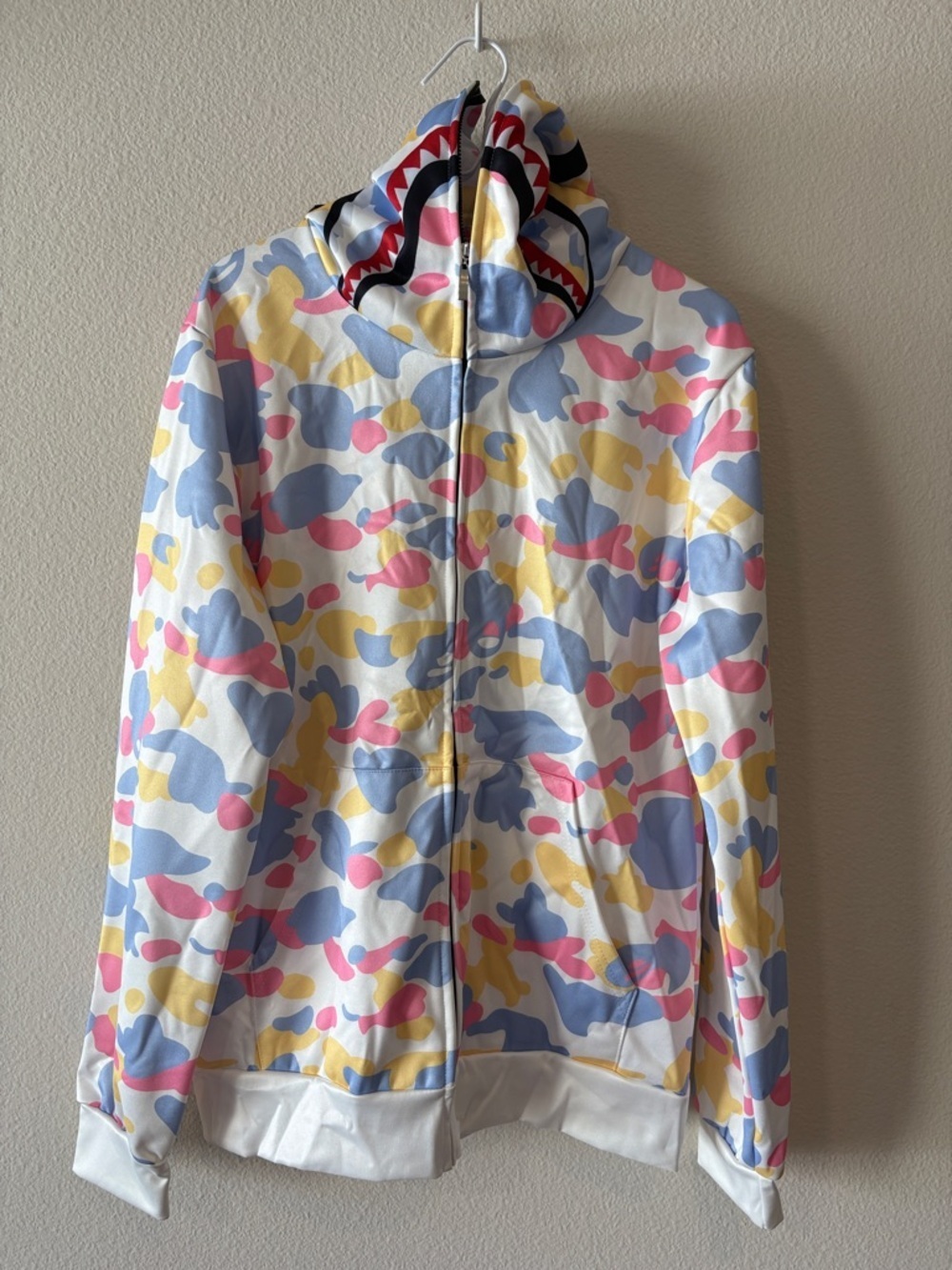 White hoodie with multi color pastel camo design
